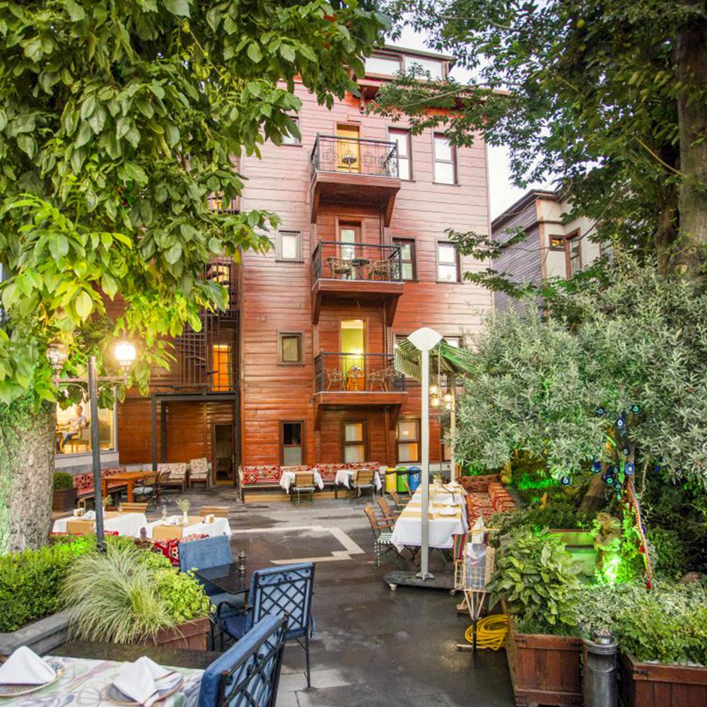 The leafy courtyard garden against the historic Ottoman building