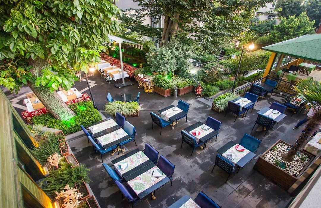 Overhead view of the courtyard garden with set blue-cloth tables