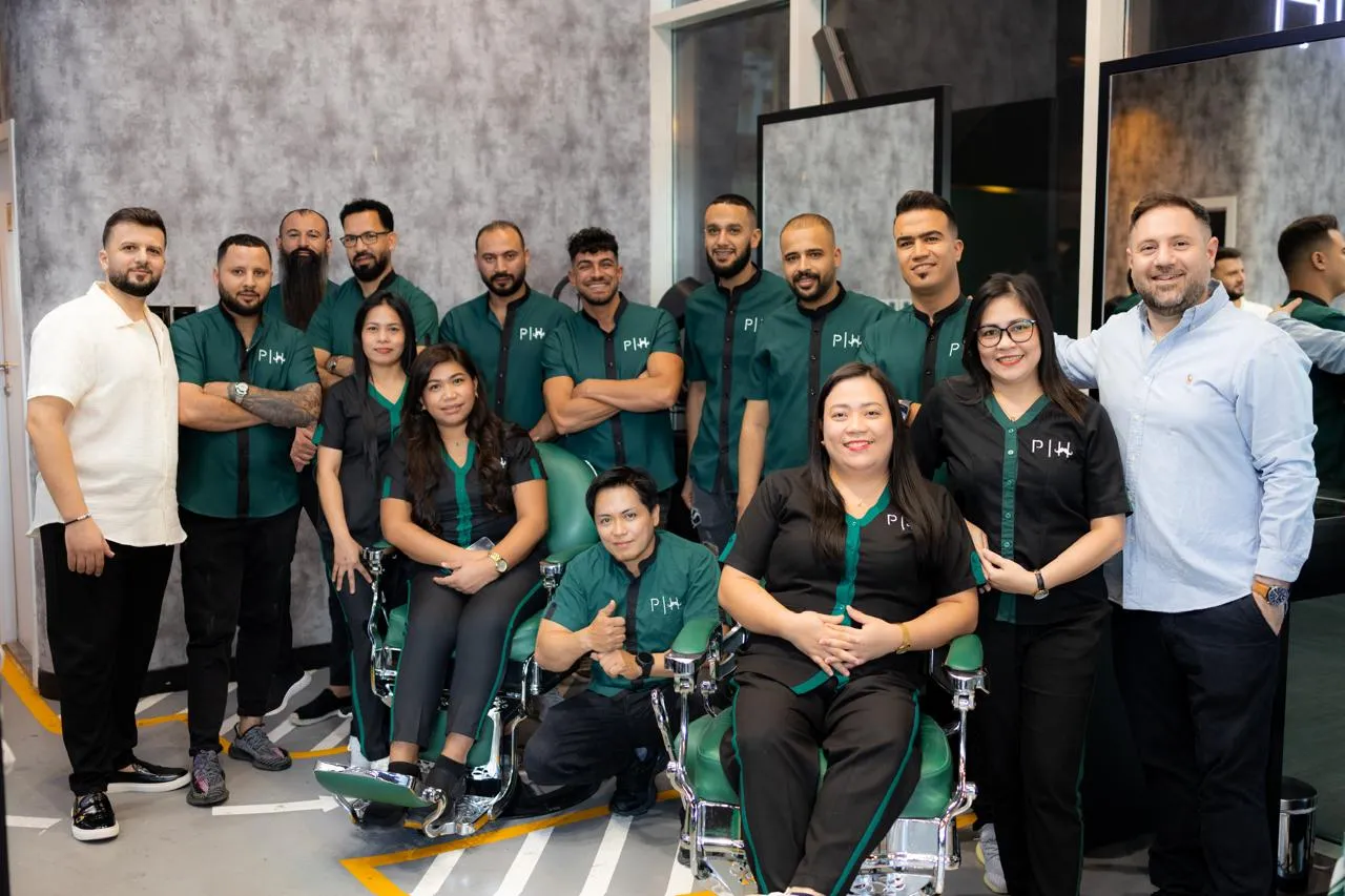 The Project Hairway barber team together in the Dubai salon