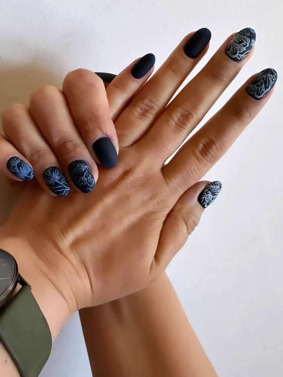 Matte black manicure with floral stamping